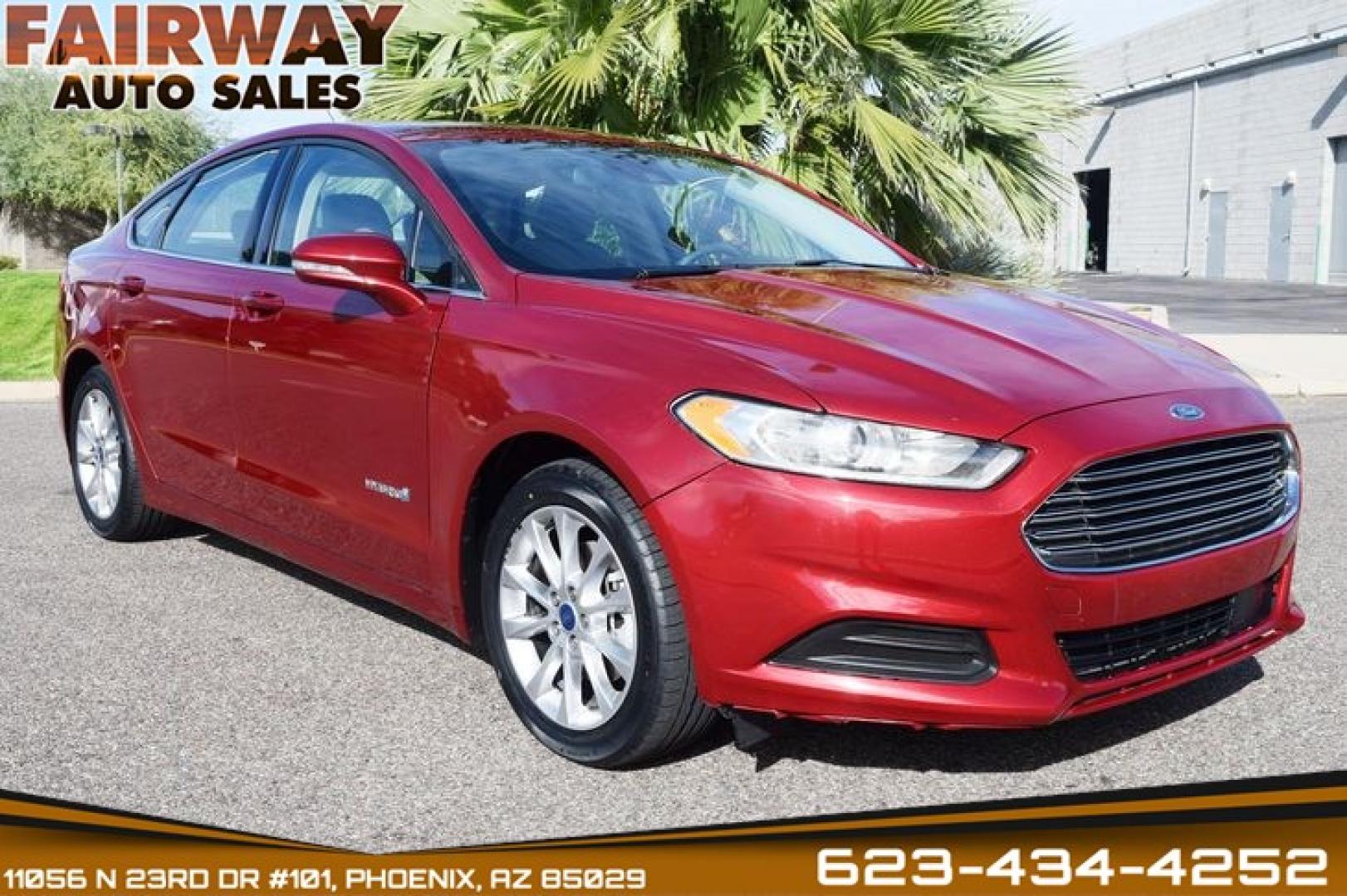 2017 Ruby Red Metallic Tinted Clearcoat /Medium Light Stone Ford Fusion Hybrid SE (3FA6P0LU2HR) with an 2.0L L4 DOHC 16V HYBRID engine, CVT transmission, located at 11056 N 23rd Dr #101, Phoenix, AZ, 85029, (623) 434-4252, 33.587704, -112.109962 - Photo#0