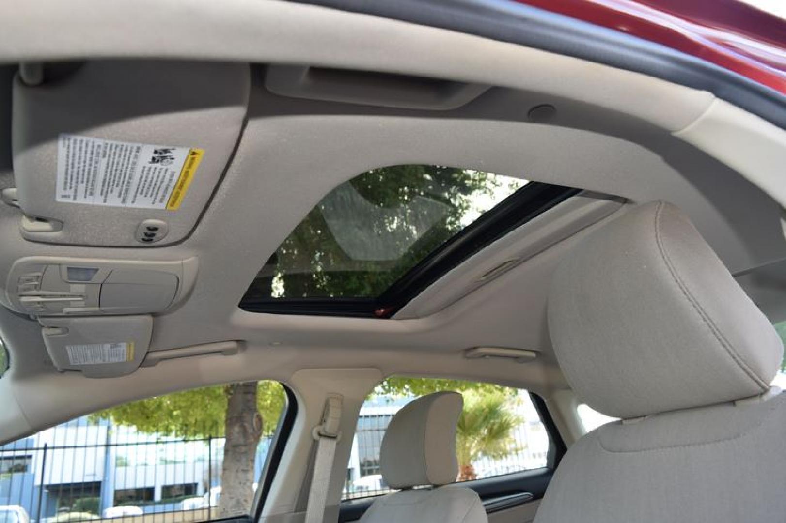 2017 Ruby Red Metallic Tinted Clearcoat /Medium Light Stone Ford Fusion Hybrid SE (3FA6P0LU2HR) with an 2.0L L4 DOHC 16V HYBRID engine, CVT transmission, located at 11056 N 23rd Dr #101, Phoenix, AZ, 85029, (623) 434-4252, 33.587704, -112.109962 - Photo#9