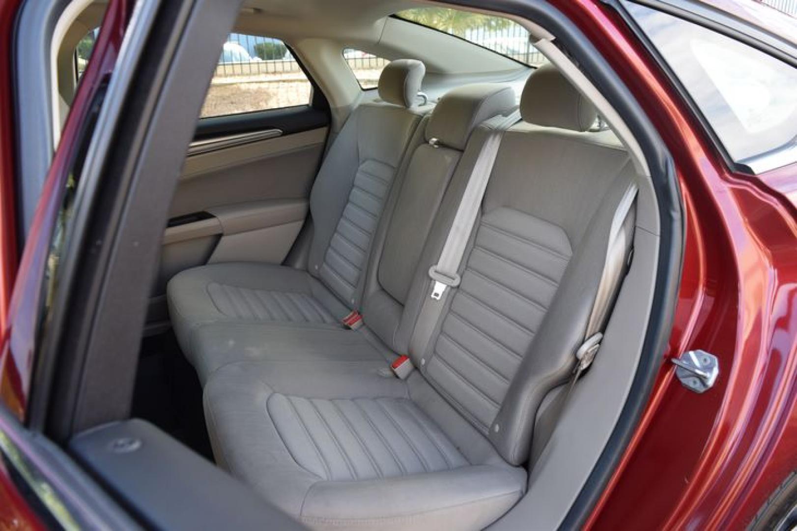 2017 Ruby Red Metallic Tinted Clearcoat /Medium Light Stone Ford Fusion Hybrid SE (3FA6P0LU2HR) with an 2.0L L4 DOHC 16V HYBRID engine, CVT transmission, located at 11056 N 23rd Dr #101, Phoenix, AZ, 85029, (623) 434-4252, 33.587704, -112.109962 - Photo#11