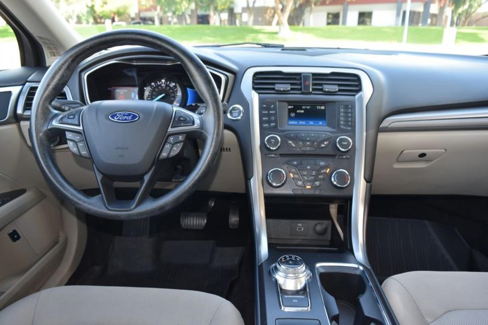2017 Ruby Red Metallic Tinted Clearcoat /Medium Light Stone Ford Fusion Hybrid SE (3FA6P0LU2HR) with an 2.0L L4 DOHC 16V HYBRID engine, CVT transmission, located at 11056 N 23rd Dr #101, Phoenix, AZ, 85029, (623) 434-4252, 33.587704, -112.109962 - Photo#16