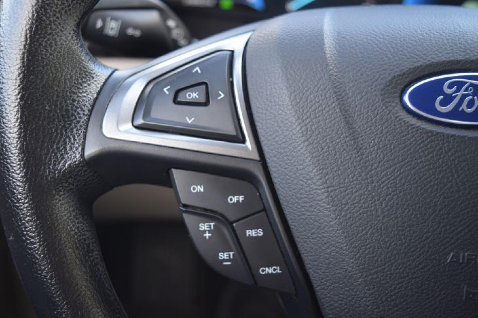 2017 Ruby Red Metallic Tinted Clearcoat /Medium Light Stone Ford Fusion Hybrid SE (3FA6P0LU2HR) with an 2.0L L4 DOHC 16V HYBRID engine, CVT transmission, located at 11056 N 23rd Dr #101, Phoenix, AZ, 85029, (623) 434-4252, 33.587704, -112.109962 - Photo#29