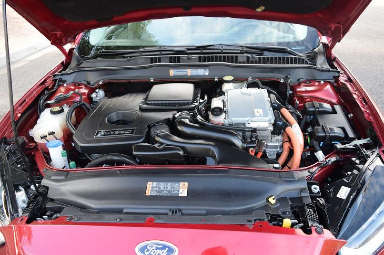 2017 Ruby Red Metallic Tinted Clearcoat /Medium Light Stone Ford Fusion Hybrid SE (3FA6P0LU2HR) with an 2.0L L4 DOHC 16V HYBRID engine, CVT transmission, located at 11056 N 23rd Dr #101, Phoenix, AZ, 85029, (623) 434-4252, 33.587704, -112.109962 - Photo#39