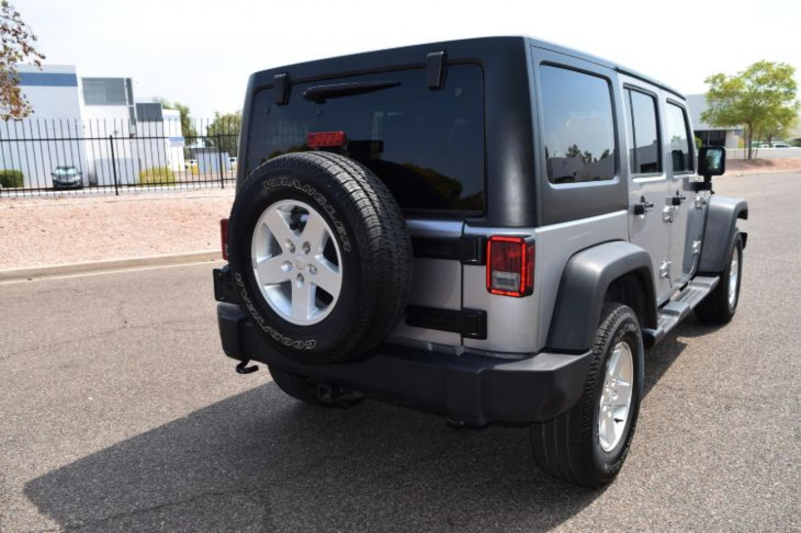 2013 Billet Silver Metallic /Black Jeep Wrangler Unlimited Sport 4WD (1C4BJWDG0DL) with an 3.6L V6 DOHC 24V FFV engine, Automatic transmission, located at 11056 N 23rd Dr #101, Phoenix, AZ, 85029, (623) 434-4252, 33.587704, -112.109962 - Photo#5