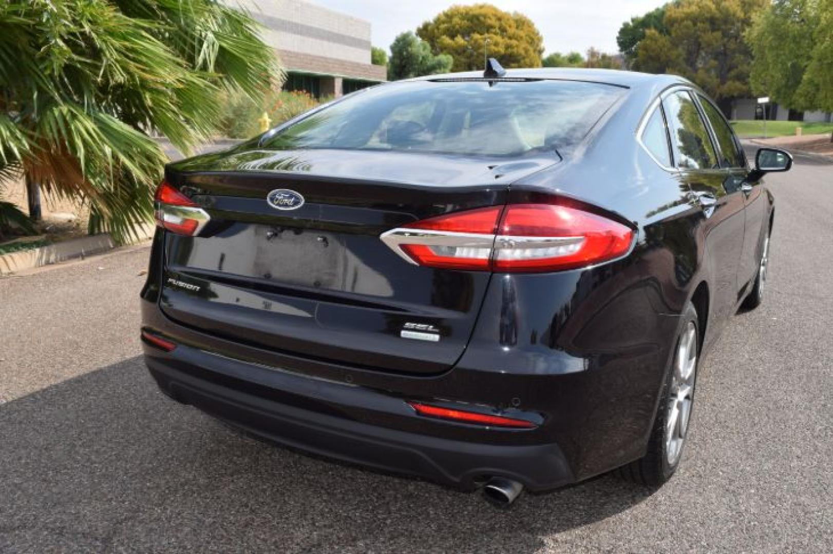 2019 Agate Black /Ebony Ford Fusion SEL (3FA6P0CD3KR) with an 1.5L L4 DOHC 16V engine, 6A transmission, located at 11056 N 23rd Dr #101, Phoenix, AZ, 85029, (623) 434-4252, 33.587704, -112.109962 - Photo#5